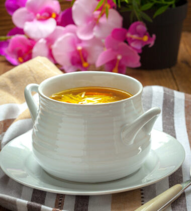 Bowl of chicken soup with vegetables and noodles